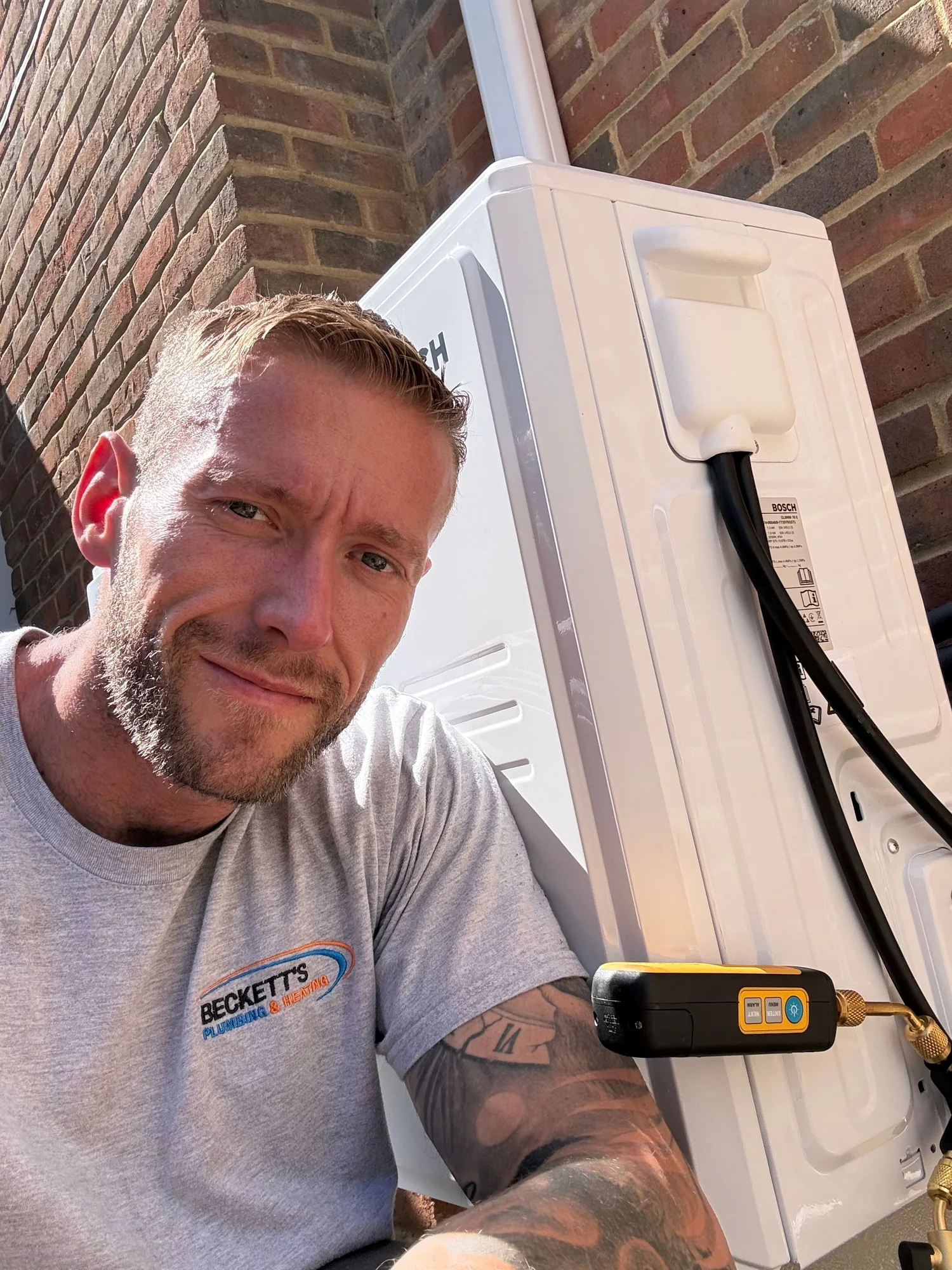 Sam Beckett, owner of Becketts Plumbing & Heating, on an air conditioning installation