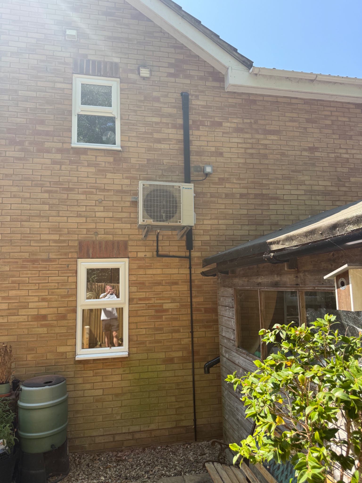 Daikin outdoor air conditioning unit fitted to the wall of a home in Southampton